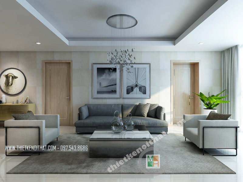 Mẫu thiết kế phòng khách chung cư đẹp với bộ sofa bọc vài màu xám và trắng tạo điểm nhấn nổi bật cho căn phòng. Thiết kế nội thất