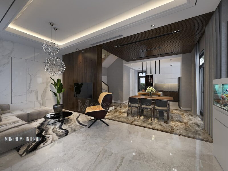 Điểm nhấn ấn tượng giữa gỗ ốp tường cùng đá lát sàn cao cấp tạo nên ánh nhìn hiện đại, cuốn hút cho phòng khách liền bếp ăn. Thiết kế nội thất