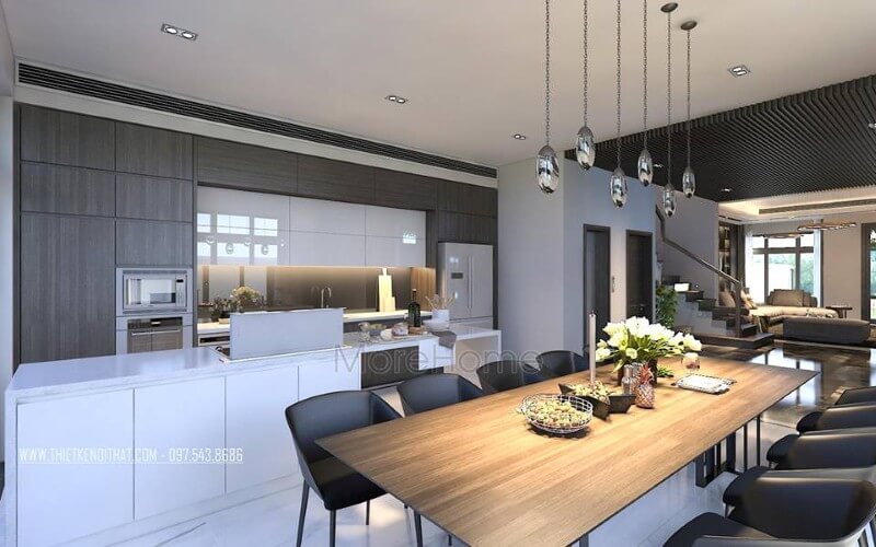 Bàn ăn gỗ nguyên tấm mộc mạc kết hợp đồ nội thất hiện đại sẽ là lựa chọn ấn tượng tạo nên không gian độc đáo cho phòng ăn liền bếp. thiết kế chung cư
